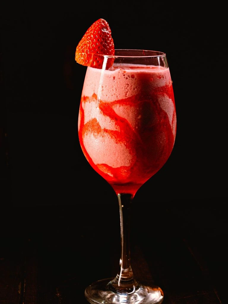 A Hemingway Daiquiri in a frosted coupe with grapefruit twist.